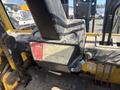 Control panel of a 1993 Hyster H80XL forklift with a warning label and ignition key visible