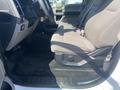 Interior view of a 2017 Ford F-150 showing the driver's seat and dashboard with fabric upholstery and a simple layout