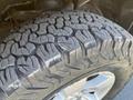 Close-up of a rugged tire on a 2015 RAM 1500 showcasing its deep tread patterns and textured surface