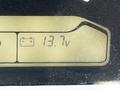 Display panel showing a battery icon and a voltage reading of 13.7 volts