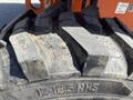 Close-up of a rugged tire from a 2008 JLG Boom Lift showing deep treads and the size designation 12-16.5 NHS