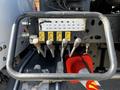 Control levers and gauge panel of a 2012 Freightliner M2 112 showing hydraulic settings with labeled sliders in yellow and black