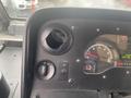 Interior dashboard of a 2012 Ford Econoline showing vehicle controls and gauges including a speedometer and air vents