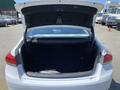 Open trunk of a 2017 Genesis G80 displaying a spacious interior with a flat floor and no visible items inside