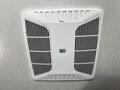 Ceiling vent from a 2021 Grand Design Recreational 311BHS with a white grille and a central logo label