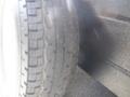 Close-up of a tire from a 2004 Royal 18 Foot Office Trailer showcasing tread patterns and sidewall details