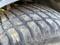 Close-up of a worn tire showing tread pattern on a 2010 Kubota F3990