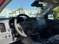 Interior view of a 2018 GMC Canyon featuring a steering wheel center console and dashboard with controls