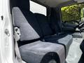 Interior view of a 2018 Hino 195 showing the front seating area with two plush fabric seats designed for comfort and functionality