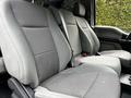 Interior seating of a 2017 Ford F-250 with gray fabric upholstery featuring two front seats and a middle seatbelt