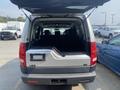 A 2006 Land Rover LR3 with an open rear hatch revealing an empty cargo area and black leather seats in the interior
