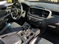 Interior of a 2017 Kia Sorento featuring black leather seats a central console with controls and a touchscreen display