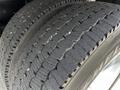 Close-up of two large, rugged tires with deep treads designed for heavy-duty use, showcasing a Michelin brand logo on the sidewall