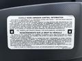 A label detailing vehicle noise emission control information for a 2018 Isuzu NPR containing regulatory and maintenance guidelines