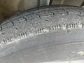 Close-up of a tire from a 2018 Hino 338 showing tread patterns and signs of wear