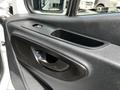 Interior door handle and armrest of a 2019 Mercedes-Benz Sprinter showcasing a sleek black design and integrated storage compartment