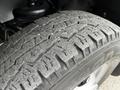 Close-up of a worn tire tread on a 2017 Chevrolet Express showcasing distinct patterns and grooves