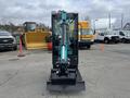 2024 AGT Industrial Green QH13R Mini Excavator with a black body and turquoise accents facing forward with a digging bucket attached