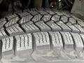 Close-up of a tire from a 2004 Ford Explorer Sport Trac showcasing its tread pattern and texture