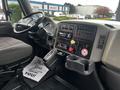 Interior view of a 2008 International 7500 truck cabin showing the dashboard controls gear shift and steering wheel