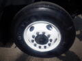 Close-up of a Goodyear tire mounted on a white wheel with multiple lug nuts on a 2016 International WorkStar 7500