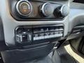 Interior dashboard of a 2020 Ram 2500 featuring climate control dials and various buttons for vehicle functions like tow haul and work lights