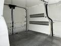 Interior of a 2019 Ford Transit Connect van with a metal floor and side panels featuring multiple horizontal storage slots