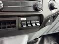 Close-up of the control panel in a 2017 Ford F-750 featuring four auxiliary switches labeled AUX 1 to AUX 4 and a gate control switch
