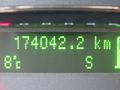 A digital display showing the odometer reading of a 2013 Ford Expedition at 174042.2 km and a temperature of 8 degrees Celsius
