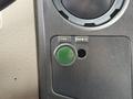 A control panel featuring buttons labeled for strobe lights and rear work lights with a green indicator light