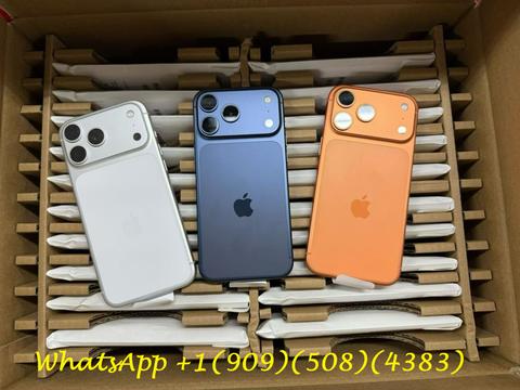 Three used Apple iPhones in white, blue, and orange arranged in a box with protective packaging