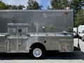 A silver 2008 Morgan Olson Workhorse vehicle with a metallic exterior and multiple compartments and doors on the side