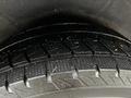 Close-up of the tread on a tire of a 2023 Mercedes-Benz Metris showing detailed grooves and patterns designed for traction on various surfaces