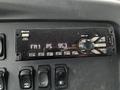 A dashboard radio display of a 2020 Freightliner 114SD showing FM station 95.3 with buttons and a knob for control