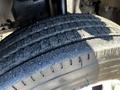 Close-up of a tire showing tread pattern and wear on a 2014 Mitsubishi Fuso FE