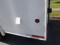 A 2004 Royal 18 Foot Office Trailer with a white exterior featuring a red circular light and a small access panel on the side