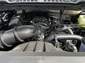 Close-up of the engine bay of a 2024 Ford F-550 showing various components including the air intake tube and engine block
