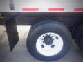 A 2016 International WorkStar 7500 truck tire with visible tread and a white rim displaying the Goodyear brand logo