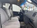 Interior view of a 2008 Dodge Ram 5500 showing front seats and dashboard with manual controls and keys hanging from ignition