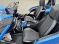 A 2020 Polaris SlingShot with a blue interior featuring two black seats a steering wheel and a central console