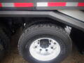 2008 International 7400 truck tire with shiny aluminum rim and rugged tread pattern