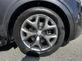Close-up of a silver alloy wheel on a 2017 Kia Sorento showing a six-spoke design and a black tire with tread pattern visible