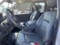 Interior of a 2019 RAM 1500 Classic featuring black leather seats and a console with cup holders
