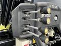 Close-up of control levers on a 2017 International WorkStar 7600 truck with labeled positions for curb side and street side functions