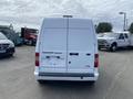 White 2013 Ford Transit Connect viewed from the rear showing the back doors and rear lights with no visible license plate