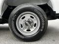 Close-up of a chrome alloy wheel on a 2017 Ford F-250 featuring a Firestone Transforce HT tire with black lettering and a six-bolt pattern