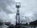 A 2011 Toyota 028FG15 forklift with an upright mast and fork tines positioned vertically