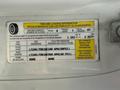A 2013 Chevrolet Express tire and loading information label displaying seating capacity and tire pressure specifications