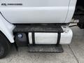 A close-up of a 2017 Ford F-750's fuel tank and step with visible branding and mounting hardware