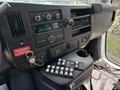 Interior view of a 2020 Chevrolet Express showing the dashboard with audio controls, air vents, and control buttons
